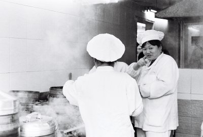 Unusually clean, this little dumpling kitchen serves a hole in the wall restaurant off the beaten track in Shanghai.
Shot on film, as most of my black and white this is what Shanghai really looks like, to most of the foreigners living there.