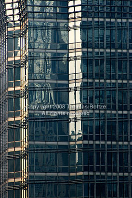 The facade of the Jin Mao Tower is an endless mosaic of pipes on top of glass. Surfaces are angled and cut up into smaller panes, and there are endless reflections of the surrounding buildings and the sky.
I must confess that this is probably the most likable building in all of Shanghai for me.

