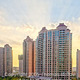 Shot as a high dynamic range image (HDR), during a rare sunset in Shanghai, the shot combines different exposures to show the unusual sky with lots of detail in the clubhouse and water. 
The living compound at the Western end of Changning district is typical for Shanghai's wealthier people, with several high rises encircling playgrounds, indoor and outdoor pools, tennis courts, golf driving range and clubhouse.
The HDR technique allows us to show the scene like the human eye would perceive it, extending the dynamic range upwards and downwards by two stops each.
